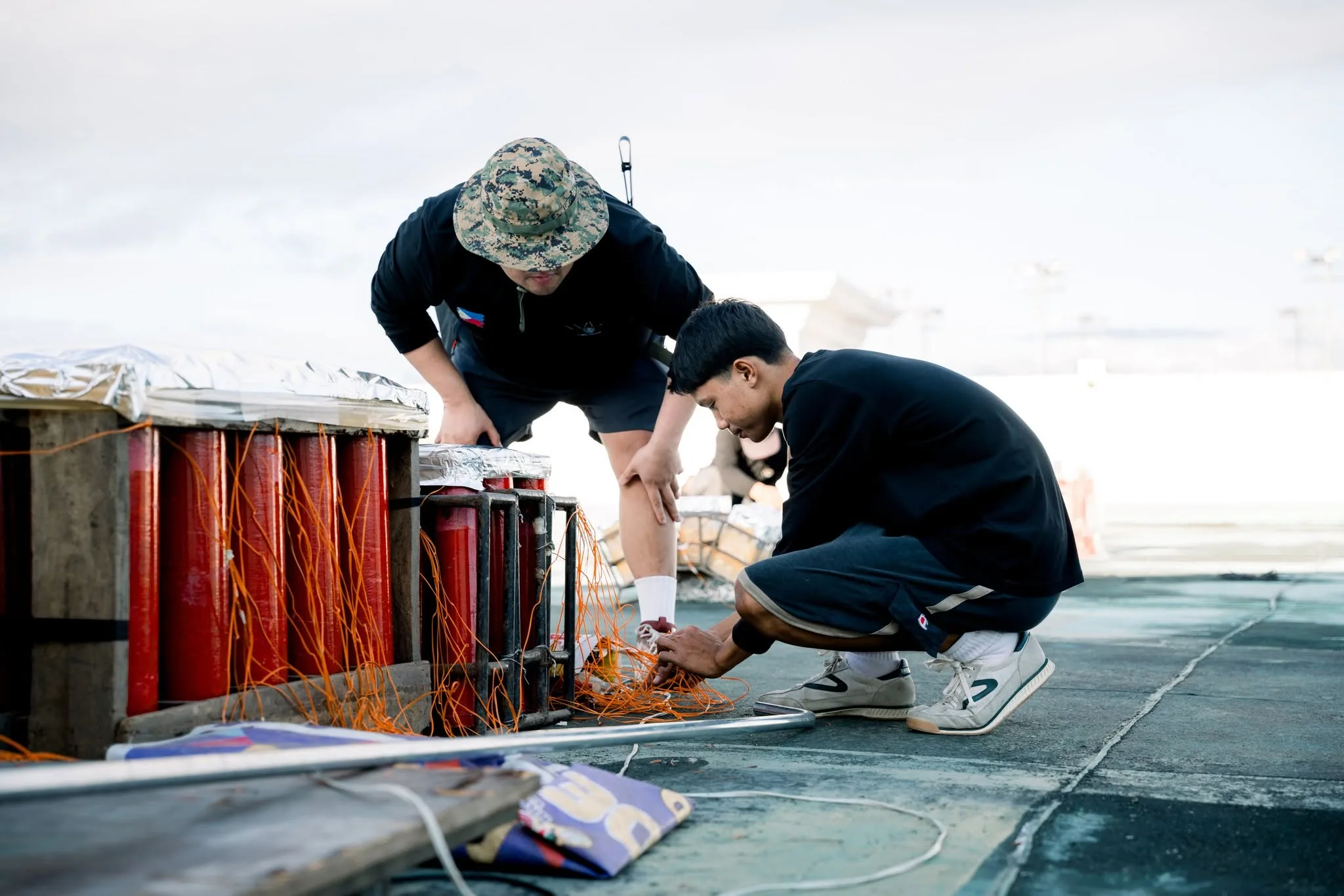 Connecting and tidying the firing wires on a bank of shells