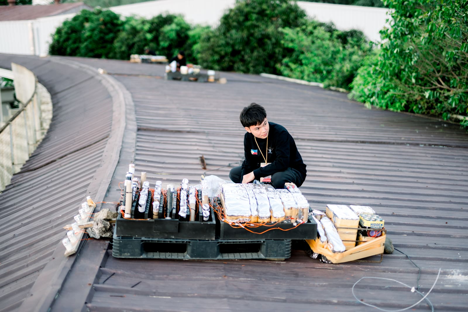 V.Lebrilla pyrotechnician setting up shells on a rooftop before a display